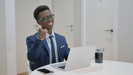 Young African Businessman Pointing at Viewer