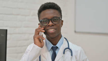African American Doctor Talking on a Smartphone