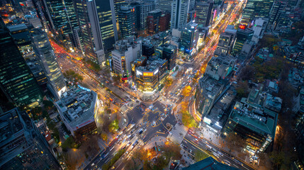 Aerial View of Bustling Intersection in Gangnam District Seoul at Night with Traffic and Skyscrapers 