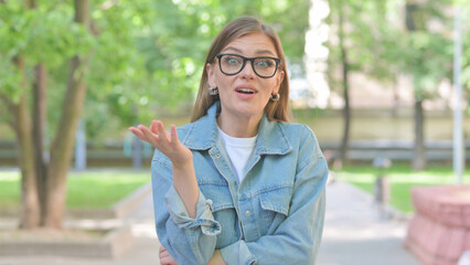 Interacting Young Woman Talking for Video Chat Outdoors