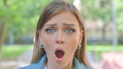 Close-up of a Shocked Young Woman Face