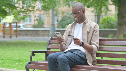 Tense Young African Man Looking Concerned with Online Transaction Failure