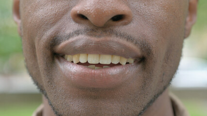 Naklejka premium Close-up of Smiling Male Mouth