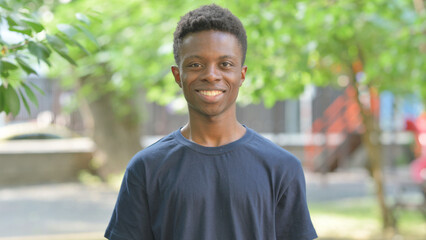 Casual African Man Making Approval Gesture Outdoors