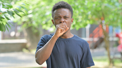 Portrait of Sick Casual African Man Coughing Outdoors
