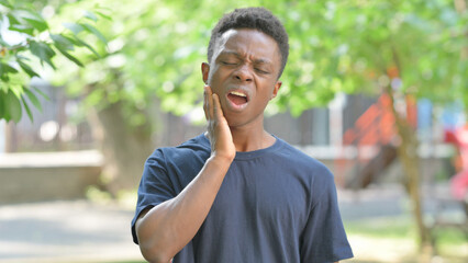 Portrait of Sick Casual African Man Toothache Outdoors