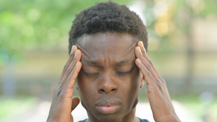 Close-up of a Man with a Painful Expression, Headache