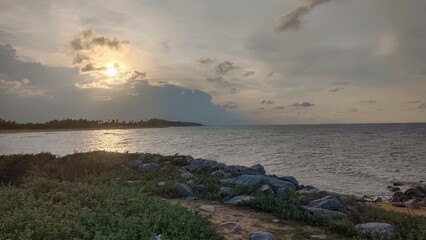 Sea sand sky concept, sunset colors clouds beachfront horizon with soft waves, meditation nature landscape, beautiful colors, wonderful scenery of tropical beach. Beachside travel summer vacation
