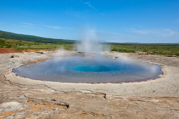 Strokkur geyser belching hot water. South area. Golden Circle. Iceland