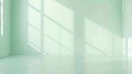 Fototapeta premium Empty mint green room with soft window light casting geometric shadows on walls