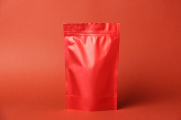 One zipper stand-up pouch on red background. Mockup for design