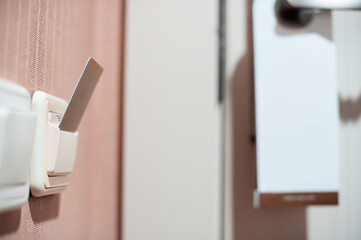 Close-Up Of Keycard Inserted Into Hotel Room Power Switch