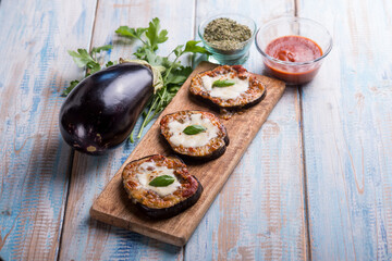 eggplants mini pizzas with mozzarella and tomatoes