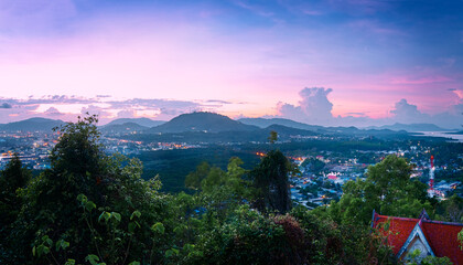 Beautiful Sunset Over Mountainous Landscape and Vibrant Countryside Town Overview