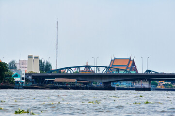 Elevated view highlighting a bridge crossing a river with surrounding traditional architecture and...