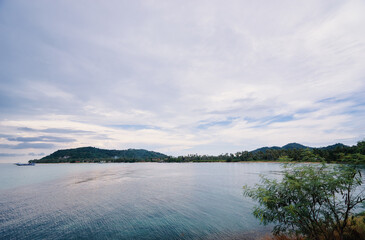 Tranquil Island Landscape with Calm Waters and Serene Sky