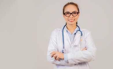 Portrait of smiling female professional doctor physician pediatrician wearing white robe with...