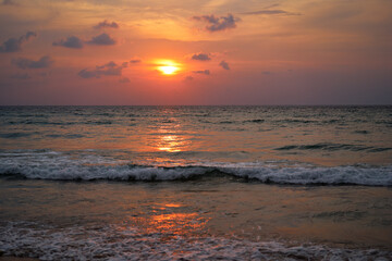 Beautiful Sunset Reflection on Ocean Waves During Calm Evening