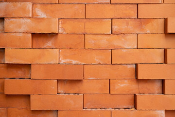 Obraz premium Orange Brick Wall with Rough Texture. Perfect for backgrounds, construction themes, architectural designs, and texture overlays.