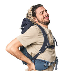 Young Caucasian hiker with backpack taking an oath, putting hand on chest.