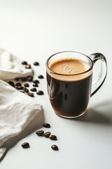 A mug of coffee with a white cloth underneath it