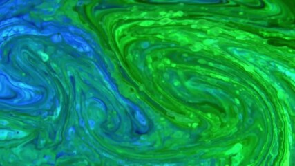 An abstract swirl of blue and green liquid creating a mesmerizing watercolor effect art piece - Powered by Adobe