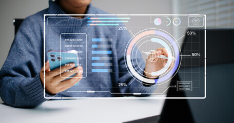 Futuristic mobile dashboard showing analytics and graphs. Hands use stylus on smartphone with data interface
