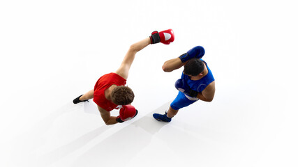 Boxers in red and blue gear engage in a sparring match viewed from above on a white background....