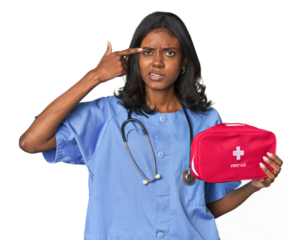 Young Indian nurse with first aid kit showing a disappointment gesture with forefinger.