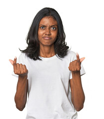 Portrait of a young Indian woman showing that she has no money.