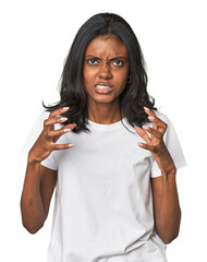 Portrait of a young Indian woman upset screaming with tense hands.