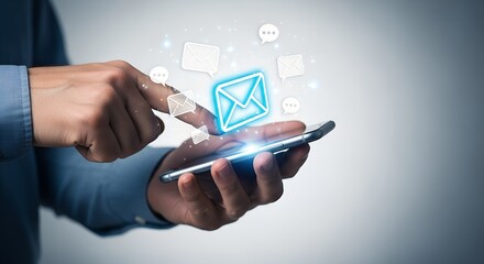 Person using smartphone with glowing email and message icons hand mobile