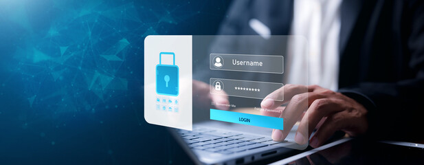 Businessman typing on laptop with virtual login interface overlay showing username, password, and...