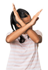 Young Filipina woman keeping two arms crossed, denial concept.