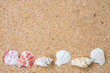 heart shaped stones on sand