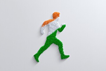 Running figure made of particles in Indian flag colors on white background