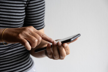 Woman using mobile app on smartphone touching screen hands digital interaction secure banking...