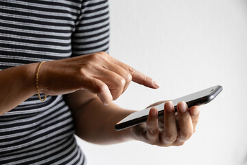 Woman using mobile app on smartphone touching screen hands digital interaction secure banking...