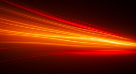 Obraz premium Abstract Orange Light Streaks on Dark Background - Motion Effect