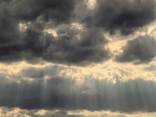 landscape stormy sky with clouds and rays of the sun
