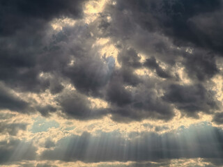 landscape stormy sky with clouds and rays of the sun