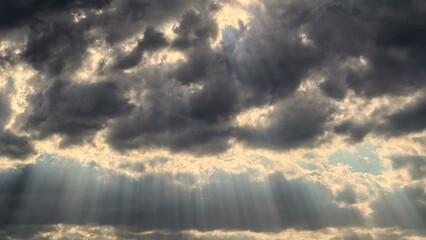 landscape stormy sky with clouds and rays of the sun