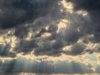 landscape stormy sky with clouds and rays of the sun
