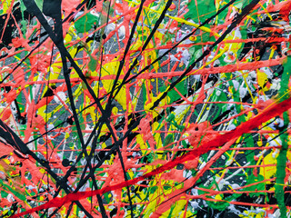 Abstract background of acrylic and latex construction paint. Green, red, yellow and black spots of...