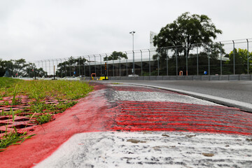 Inside rumble strip at Circuit de Gille Villeneuve Montreal Formula 1 circuit on a wet day