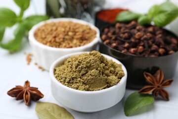 Different aromatic spices on white table, closeup