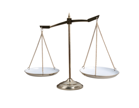 A traditional golden brass balance scale stands ready to weigh and symbolize justice and fairness.