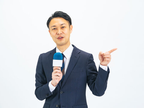 Middle-aged male announcer speaking with a microphone