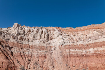 Obraz premium Toadstool Hoodoos Trail, Kane County, Utah geology. Entrada Sandstone with Carmel Formation, upper unit (Middle Jurassic). slope-forming and earthy-weathering. Sedimentary rocks.