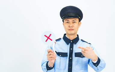 Male security guard showing cross mark